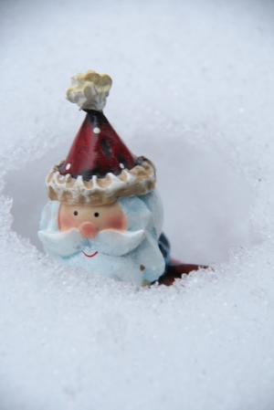 Santa almost buried in snow